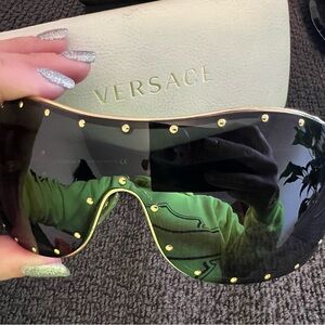 Pre owned Versace black & gold studed shield sunglasses with case.